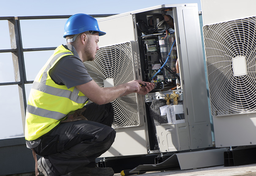 Photo of electrician checking system functions